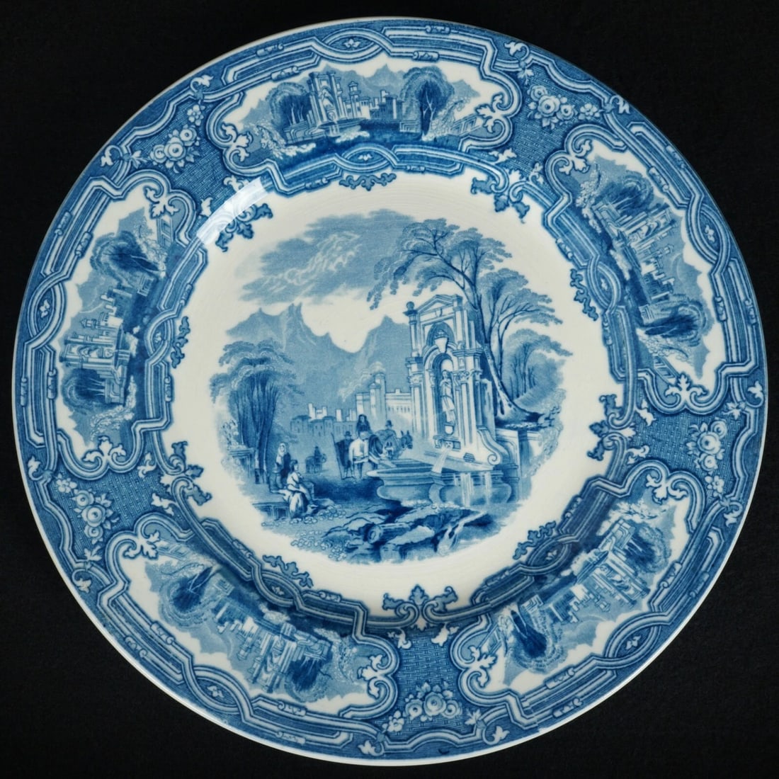 1920s Staffordshire Plate Genoa Pattern: Title:1920s Staffordshire Plate Genoa Pattern Size:10 3/8 in (26.2 cm) diameter x 7/8 in (2.2 cm) tall. Description:A large deep blue transferware plate with an Italianate pattern called Genoa. It has