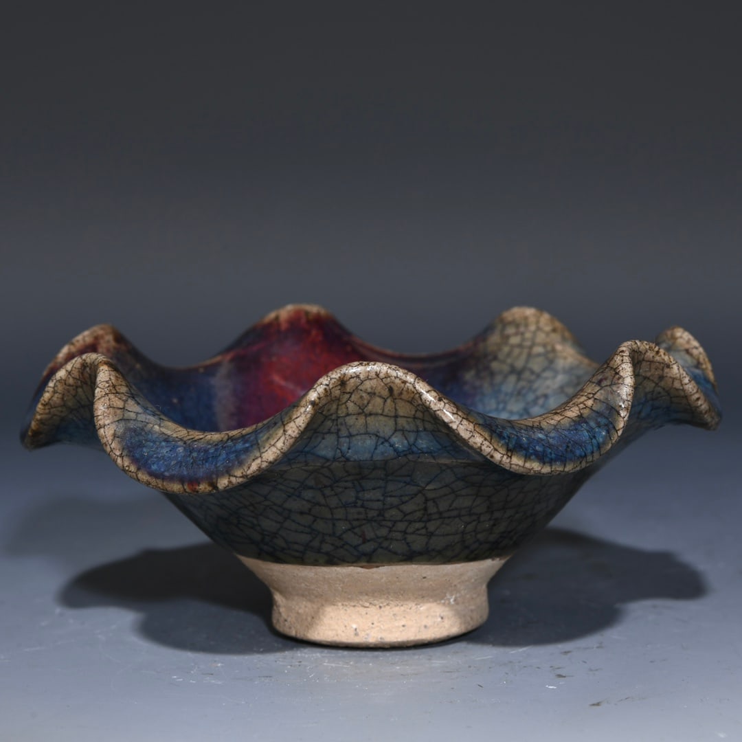 Variable Glaze Jun Kiln Porcelain Flower Edge Bowl: Title: Variable Glaze Jun Kiln Porcelain Flower Edge Bowl Origin: Chinese Date/Period: After1900 Materials: Porcelain Dimensions: 127x56(mm) 5.00x2.20(inches) Reserve: $260.00 Shipping: Domestic: Shi