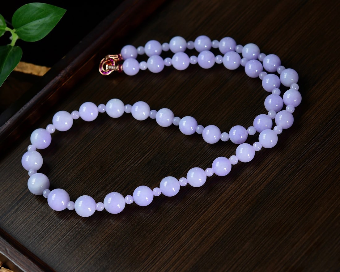 Natural Purple Jadeite Necklace with Certificate: Title: Natural Purple Jadeite Necklace with Certificate Origin: Chinese Date/Period: After2026 Materials: Jadeite Dimensions: 9-12(mm) 0.35x0.47(inches) Reserve: $2,289.00 Shipping: Domestic: Shippin