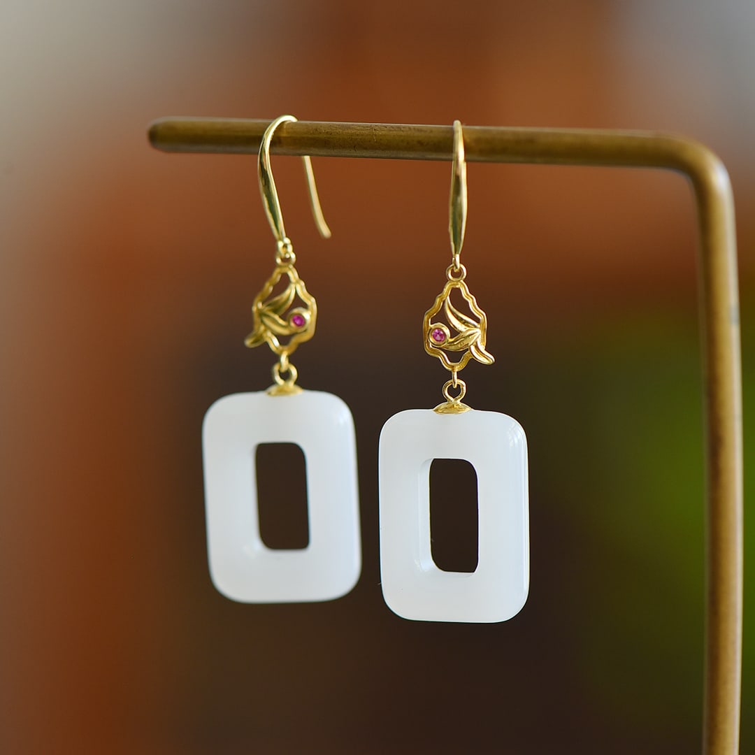 A Pair 18K Gold Inlay Hetian Jade Earrings: Title: A Pair 18K Gold Inlay Hetian Jade Earrings Origin: Chinese Date/Period: After2020 Materials: 18K Gold,Hetian Jade Dimensions: 40x13(mm) 1.57x0.51(inches) Reserve: $399.00 Shipping: Domestic: