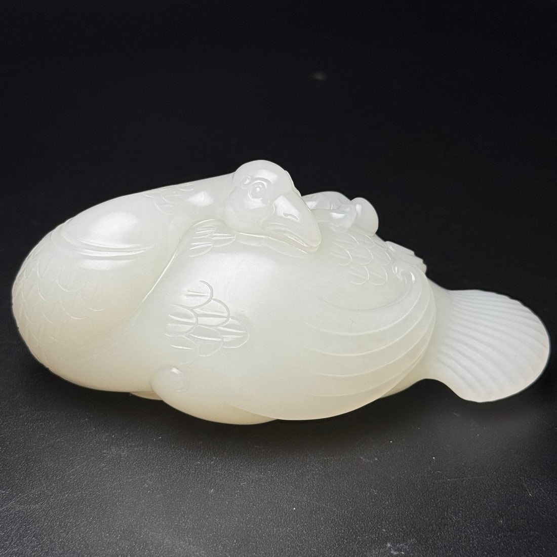 White Hetian Jade Hand Carved Goose Statue: Title: White Hetian Jade Hand Carved Goose Statue Origin: Chinese Date/Period: After2000 Materials: Hetian Jade Dimensions: 113x60x51(mm) 4.45x2.36x2.01(inches) Weight 0.78 lbs/355g Reserve: $1,999.00