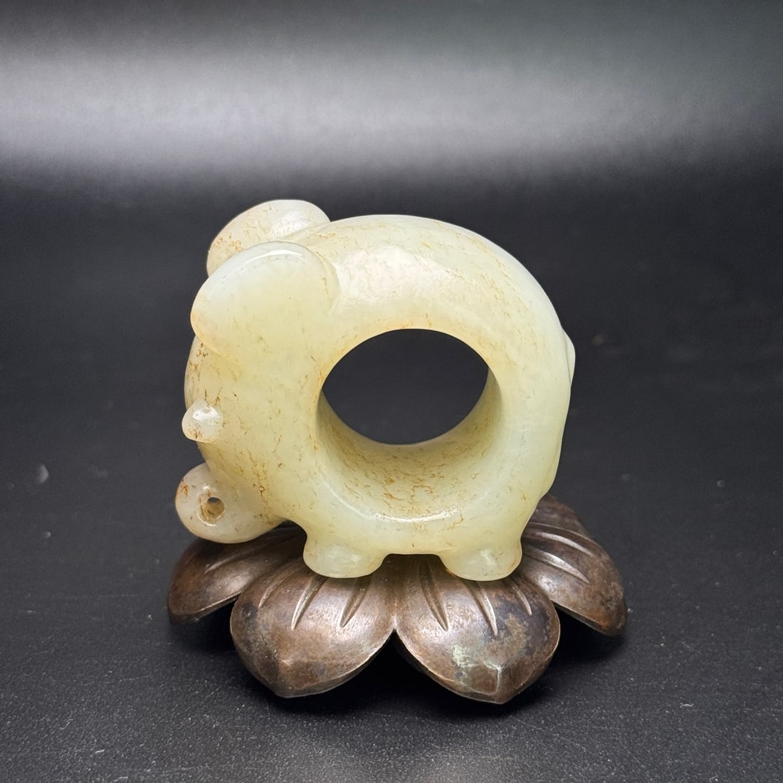 Inside Diameter 23mm Hetian Jade Elephant Thumb Ring: Title: Inside Diameter 23mm Hetian Jade Elephant Thumb Ring Origin: Chinese Date/Period: After1900 Materials: Hetian Jade Dimensions: 50x43x29(mm) 1.97x1.69x1.14(inches) Weight 0.21 lbs/94g Reserve: $