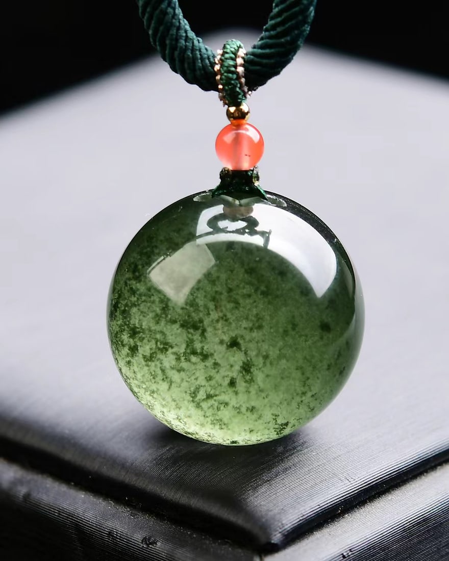 Green Crystal Lucky Ball Pendant with Certificate: Title: Green Crystal Lucky Ball Pendant with Certificate Origin: Chinese Date/Period: After2026 Materials: Green Crystal Dimensions: 21x21(mm) 0.83x0.83(inches) Weight 0.04 lbs/18.4g Reserve: $259.00