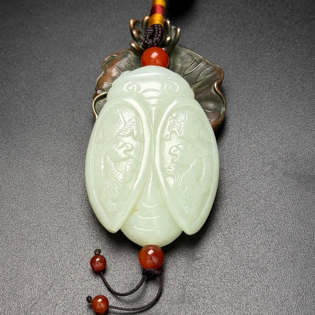 Hetian Jade Cicada Pendant: Title: Hetian Jade Cicada Pendant Origin: Chinese Date/Period: After2000 Materials: Hetian Jade Dimensions: 45x62x16(mm) 1.77x2.44x0.63(inches) Weight 0.17 lbs/78g Reserve: $449.00 Shipping: Domestic