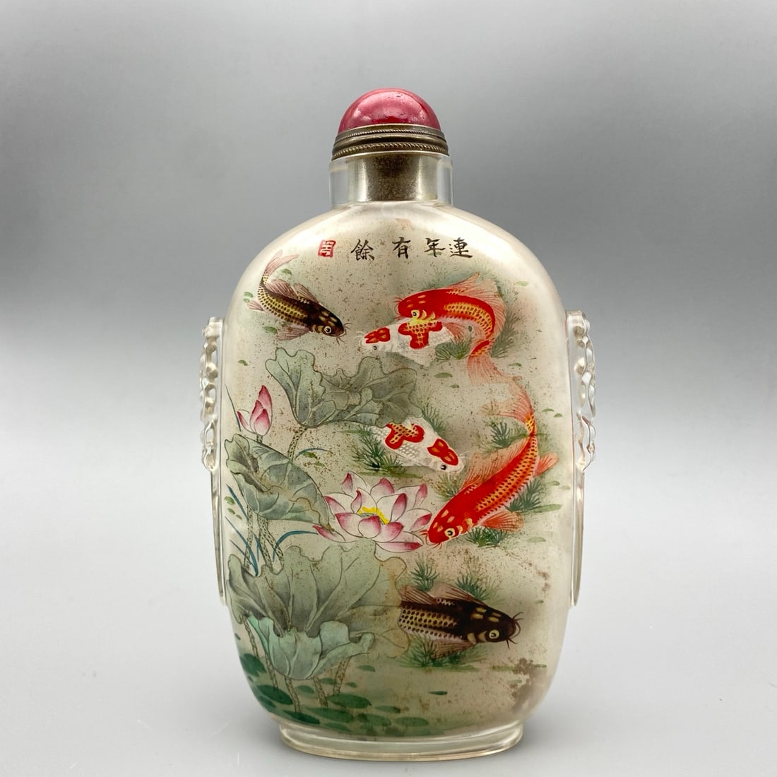 Old Peking Glass Inside Painting Fish Lotus Snuff Bottle: Title: Old Peking Glass Inside Painting Fish Lotus Snuff Bottle Origin: Chinese Date/Period: After1900 Materials: Peking Glass Dimensions: 150x90x40(mm) 5.91x3.54x1.57(inches) Weight 0.68 lbs/309g Res
