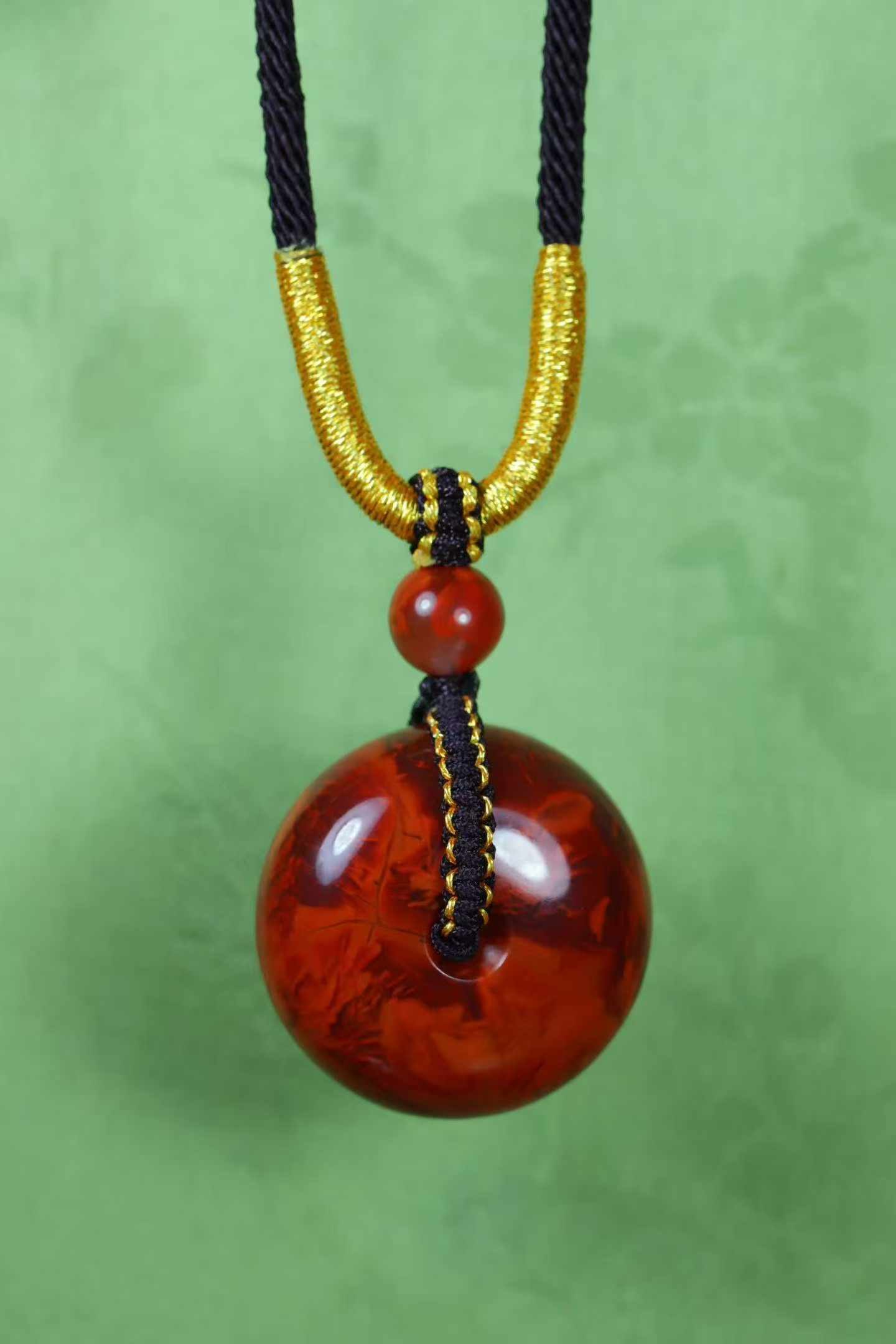 Natural Nanhong Agate Lucky Pendant with Certificate: Title: Natural Nanhong Agate Lucky Pendant with Certificate Origin: Chinese Date/Period: After2026 Materials: Nanhong Agate Dimensions: 24.8x14(mm) 0.98x0.55(inches) Weight 0.03 lbs/14.8g Reserve: $1,