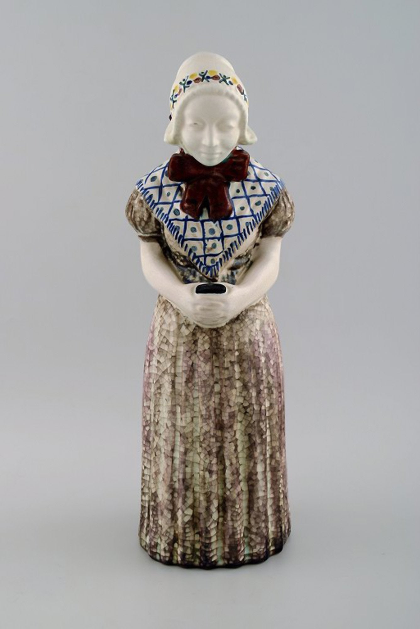 Michael Andersen Ceramics from Bornholm. Large figure of woman with Songbook in national dress. No. - 2