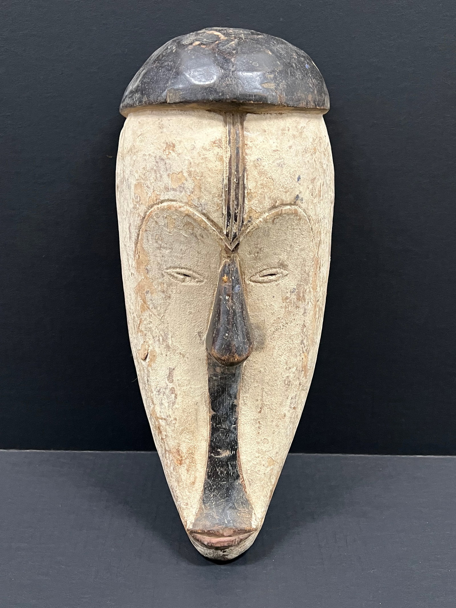 African Tribal Art Carved Wood Fang Mask: Title: Fang Mask Date/Period: Late 20th Century Materials: Wood Size: 19" h x 8" w Reserve: $80.00 Shipping: Domestic: Flat-rate of $30.00 to anywhere within the contiguous U.S. International: Foreign