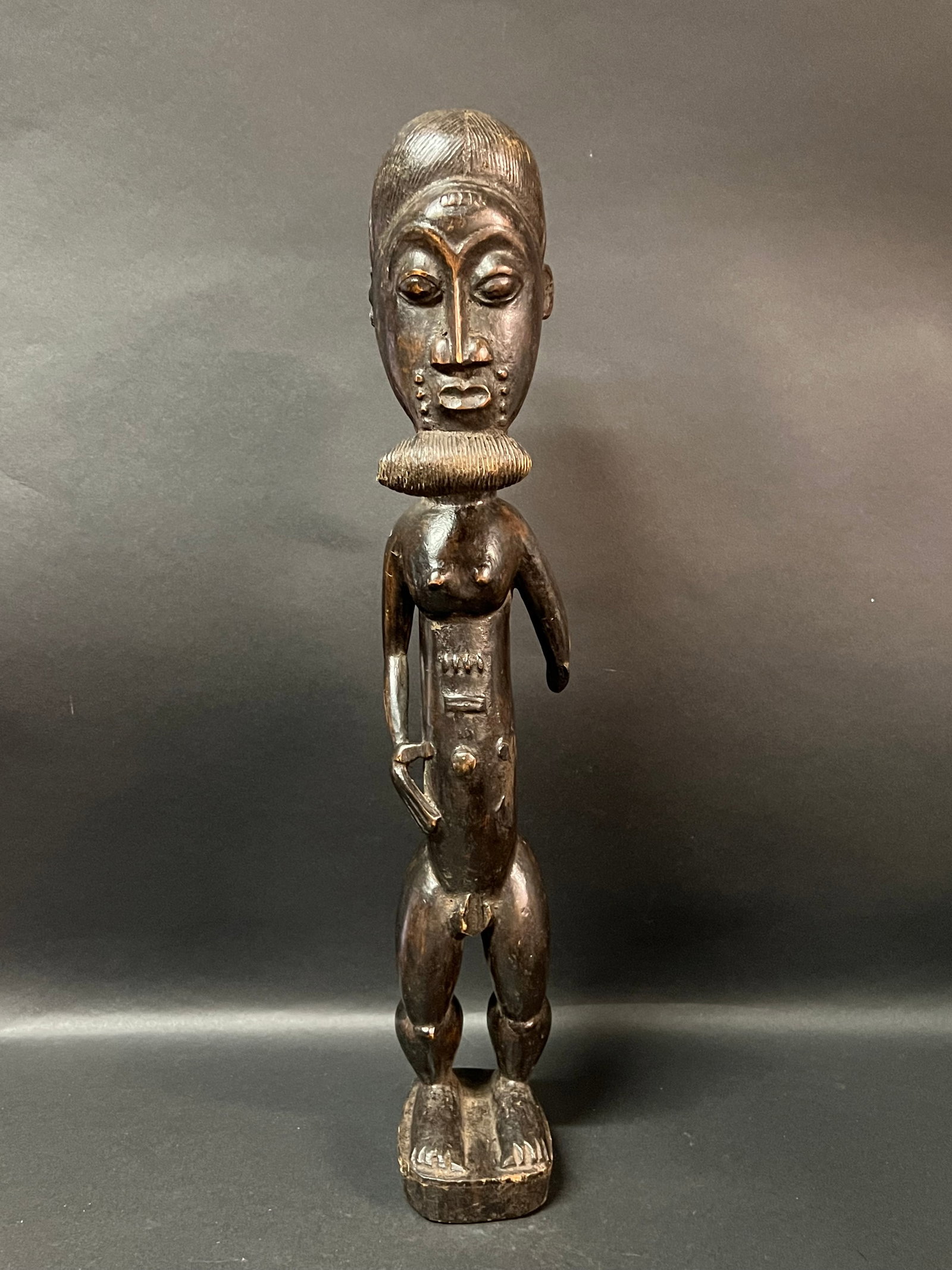 African Tribal Art Carved Wood Baule Statue: Title: Baule Statue Date/Period: Late 20th Century Materials: Wood Size: 19.5" h x 3.5" w Reserve: $100.00 Shipping: Domestic: Flat-rate of $30.00 to anywhere within the contiguous U.S. International: