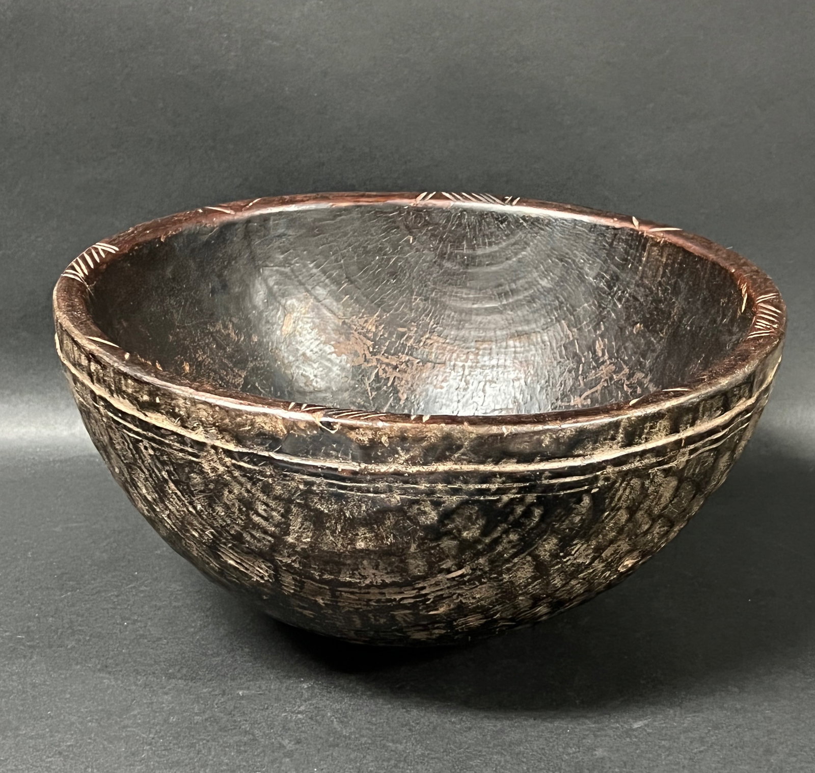 African Tribal Art Carved Wood Tanzania Bowl: Title: Tanzania Bowl Date/Period: Late 20th Century Materials: Wood Size: 6" h x 12" w Reserve: $80.00 Shipping: Domestic: Flat-rate of $30.00 to anywhere within the contiguous U.S. International: For