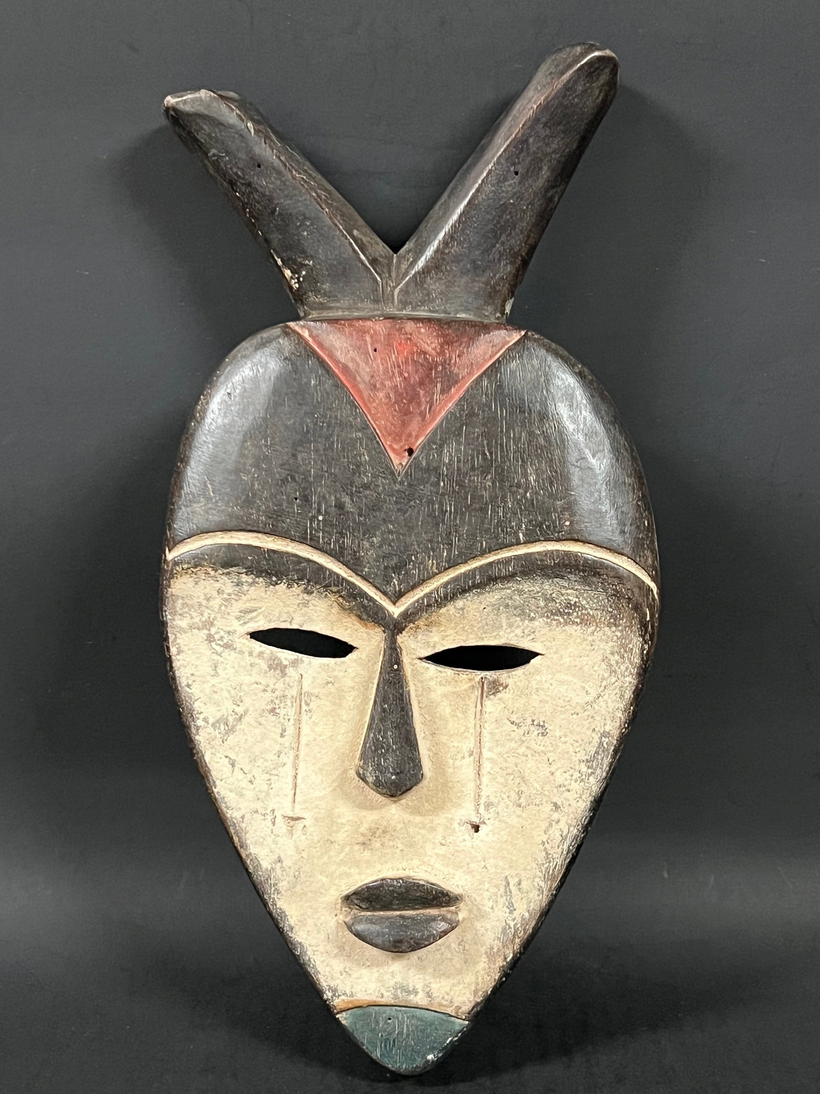 African Tribal Art Carved Wood Vuvi Mask: Title: Vuvi Mask Date/Period: Late 20th Century Materials: Wood Size: 12.5" h x 6.75" w Reserve: $60.00 Shipping: Domestic: Flat-rate of $30.00 to anywhere within the contiguous U.S. International: Fo