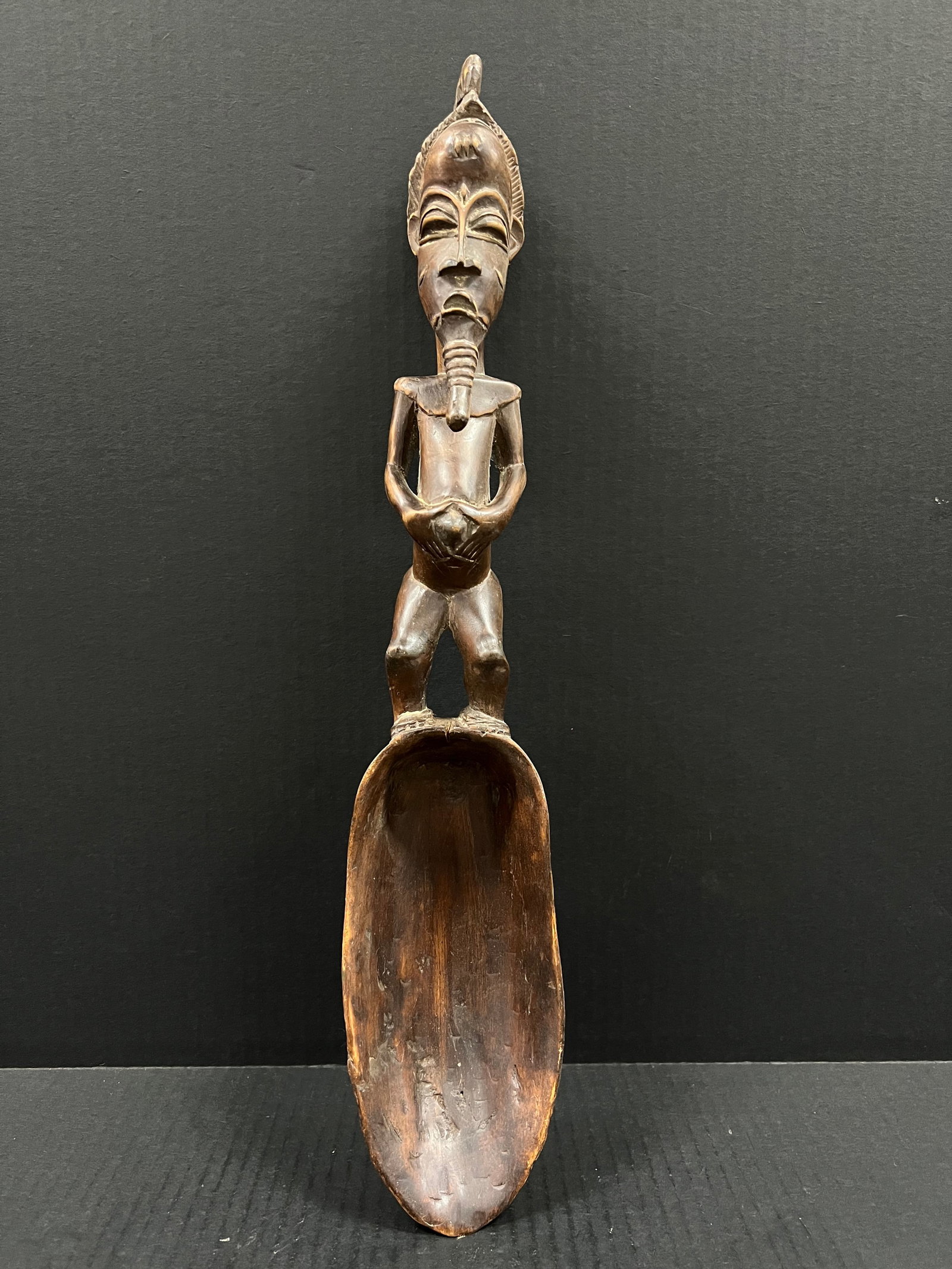 African Tribal Art Carved Wood Baule Spoon: Title: Baule Spoon Date/Period: Late 20th Century Materials: Wood Size: 19.5" h x 4" w Reserve: $150.00 Shipping: Domestic: Flat-rate of $30.00 to anywhere within the contiguous U.S. International: Fo