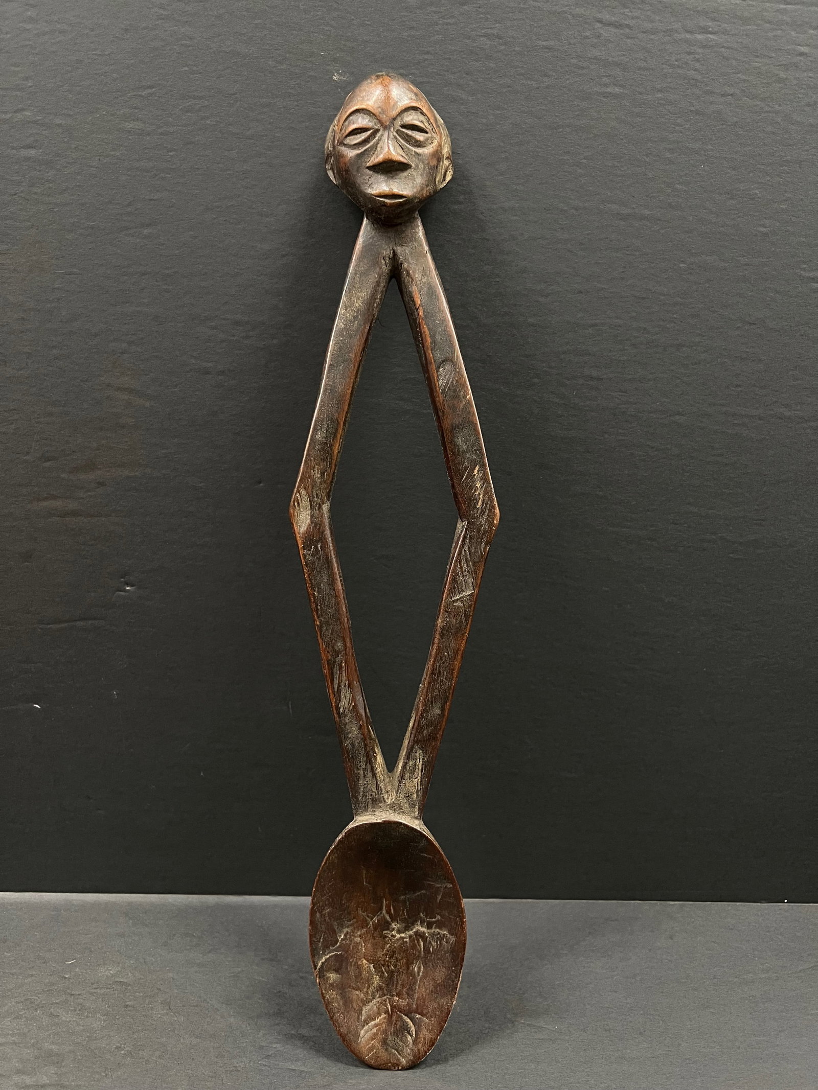 African Tribal Art Carved Wood Kuba Spoon: Title: Kuba Spoon Date/Period: Late 20th Century Materials: Wood Size: 18.5" h x 4" w Reserve: $80.00 Shipping: Domestic: Flat-rate of $30.00 to anywhere within the contiguous U.S. International: Fore