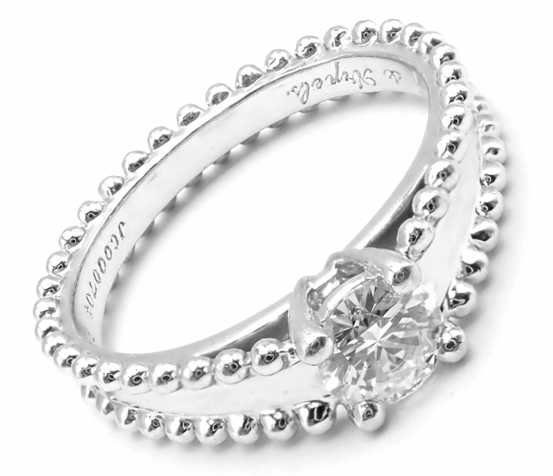 Authentic! Van Cleef & Arpels Estelle Platinum .31ct Diamond Solitaire Ring GIA: Authentic! Van Cleef & Arpels Estelle Platinum .31ct Diamond Solitaire Ring GIA About This Piece: 1 Brilliant Cut Diamond VVS2 clarity, E color weight .31ct Fluorescence NONE Polish Excellent Symmetry