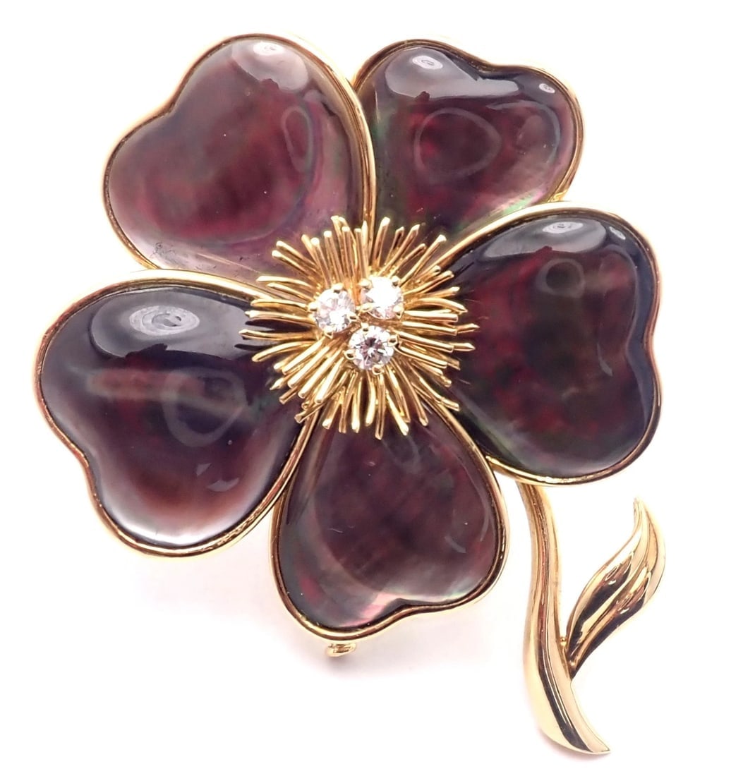 Van Cleef & Arpels Clématite 18k Yellow Gold Diamond Gray Mother of Pearl Brooch: Van Cleef & Arpels Clématite 18k Yellow Gold Diamond Gray Mother of Pearl Brooch About This Piece: This brooch comes with service paper from VCA store in New York and a VCA box. Metal: 18k Yellow