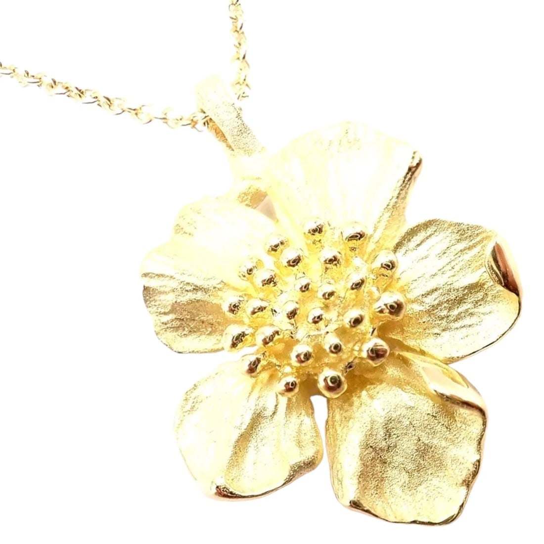 Authentic! Vintage Tiffany & Co 18K Yellow Gold Dogwood Flower Pendant Necklace: Authentic! Vintage Tiffany & Co 18K Yellow Gold Dogwood Flower Pendant Necklace About This Piece: The Vintage Tiffany & Co 18K Yellow Gold Dogwood Flower Pendant Necklace is a charming piece that