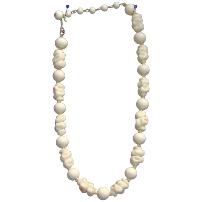 Vintage Hand Strung Milk Glass Bead Necklace: This is an older Hand Strung Milk Glass Bead Necklace. It measures 16" in length and will make a loop of 8". A little history: In a world of fast fashion and machine-made accessories, hand-knotted