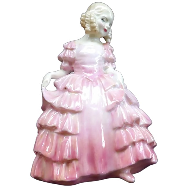 Rose by Royal Doulton: This figurine named Rose by Royal Doulton was introduced in the 1930's. It number as HN1368 and has been retired for many years. It is in excellent condition with NO chips, crazing or other problems.