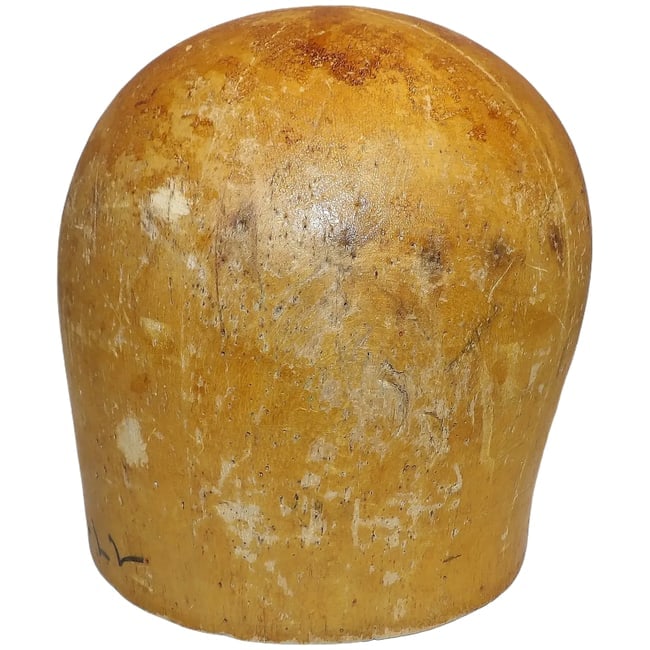 Antique Wooden Millinery Hat Mold Block Natural Finish Display Piece: This antique wooden millinery hat mold block exudes timeless charm with its natural wood finish. An excellent addition for milliners or as a decorative display. * Wood construction * Smooth natural