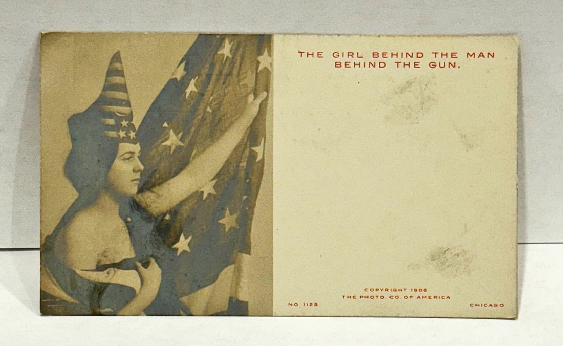 RPPC Woman in American Flag Dress w Flag 'Girl Behind the Man Behind the Gun' (1 of 2)