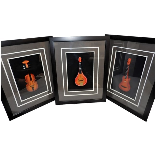 Framed 3D Miniature Musical Instruments: This set of Framed 3D Miniature Musical Instruments is in excellent condition. They make a striking display for the music lover in the family or for a friend. They include a violin, guitar, and