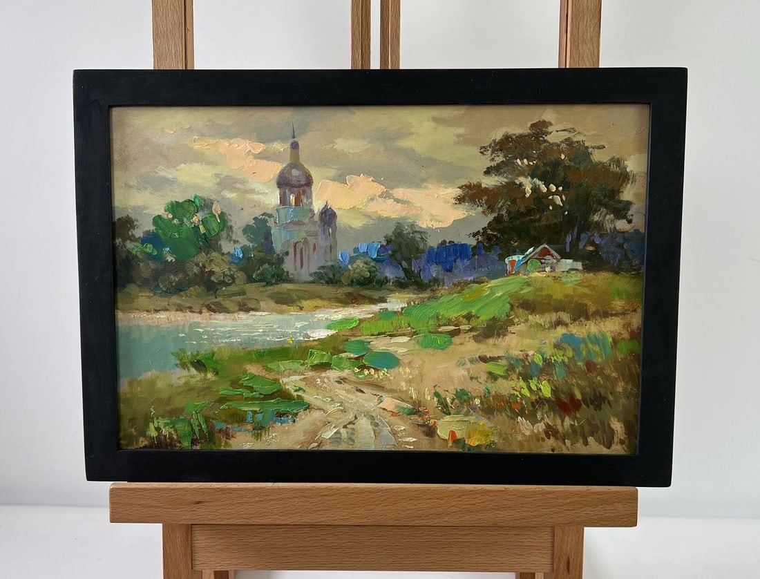 Oil painting Church over the river Yuriy Suprunchuk: Title: Oil painting Church over the river Yuriy Suprunchuk Description: NoAAA5290 The oil painting on Cardboard titled "Church over the River" portrays a moment of spiritual serenity in a rural landsc