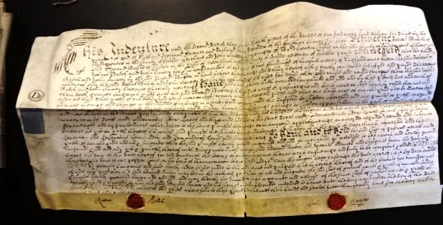 1696 English Vellum Deed Red Wax Seals: Nicely penned English vellum indenture dated 1696 during the reign of William the Third being the conveyance of property in Somerset between a merchant and John Harvey the younger of Bridgewater Castl