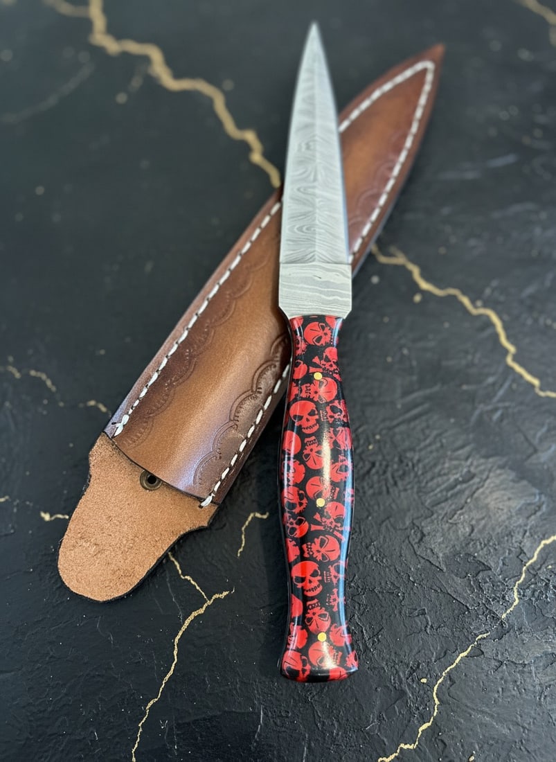 Hand-Forged Damascus Steel Boot Dagger Skull Handle Knife Leather Sheath: Title:Hand-Forged Damascus Steel Boot Dagger Skull Handle Knife Leather Sheath Description:This handcrafted knife features a durable blade and a distinctive resin skull comfort grip handle. It is supp