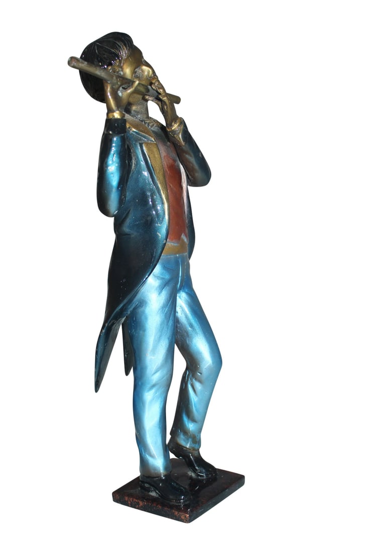 Boy Playing the Flute Bronze Statue - Size: 5"L x 10"W x 19"H.: Title:Boy Playing the Flute Bronze Statue - Size: 5"L x 10"W x 19"H. Description:This amazing and creative abstract of a musician playing the flute is exquisite. The sculpture is made with the