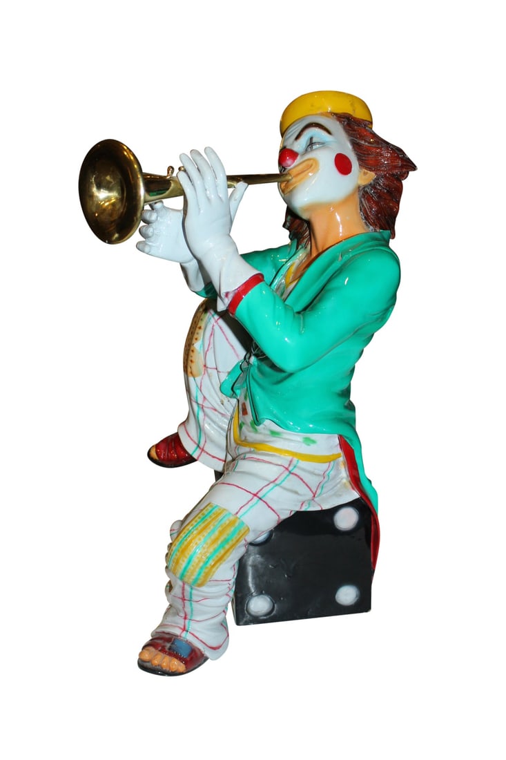 Colorful Clown Playing Instrument Bronze Statue - Size: 18"L x 13"W x 31"H.: Title:Colorful Clown Playing Instrument Bronze Statue - Size: 18"L x 13"W x 31"H. Description:Decorative Bronze Loveable Clown statue seating on a black bronze Dice base and playing an instrument. The
