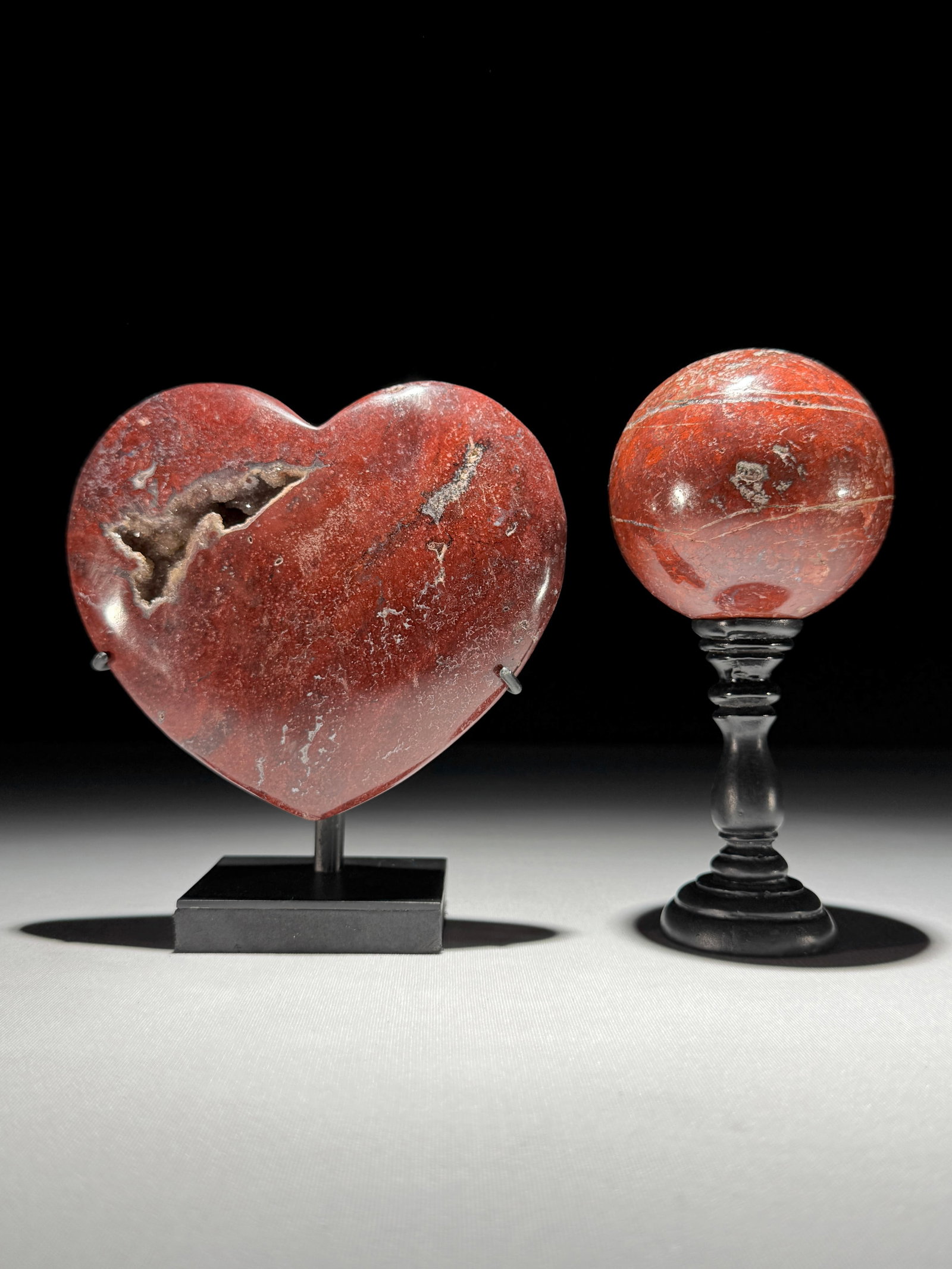 Stunning set of a crystallized Red Jasper heart and sphere on stands: Title: Stunning set of a crystallized Red Jasper heart and sphere on stands Maker:Unknown Origin: Indonesia Date/Period:2026 Materials:Red Jasper Dimensions:Height 1: 13.5 cm / inches Width: 11.7 cm