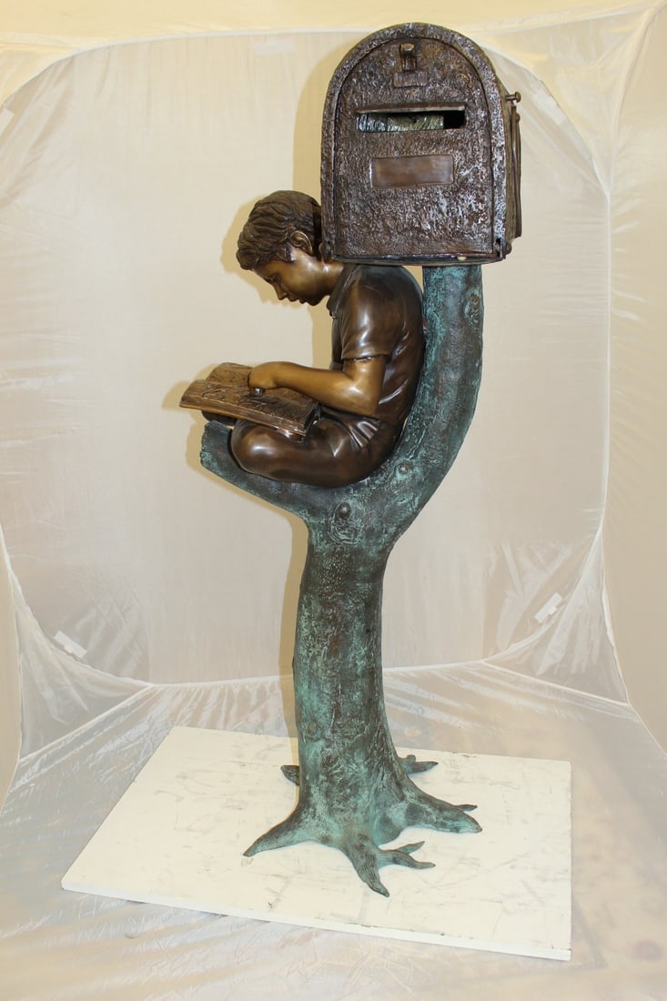 Boy Sitting by a Mailbox reading a book Bronze Statue - 16"L x 20"W x 50"H. - 10
