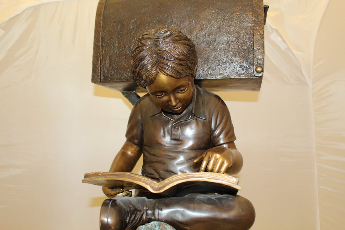Boy Sitting by a Mailbox reading a book Bronze Statue - 16"L x 20"W x 50"H. - 12