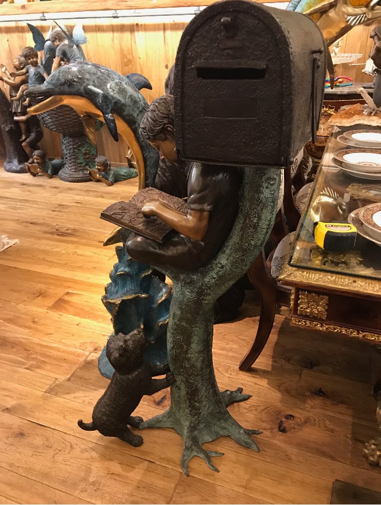 Boy Sitting by a Mailbox reading a book Bronze Statue - 16"L x 20"W x 50"H. - 5