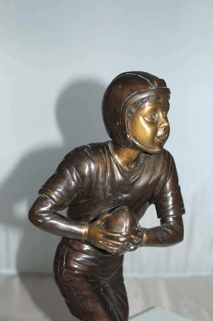 Boy playing football Bronze Statue - Size: 10"L x 8"W x 20"H. - 5