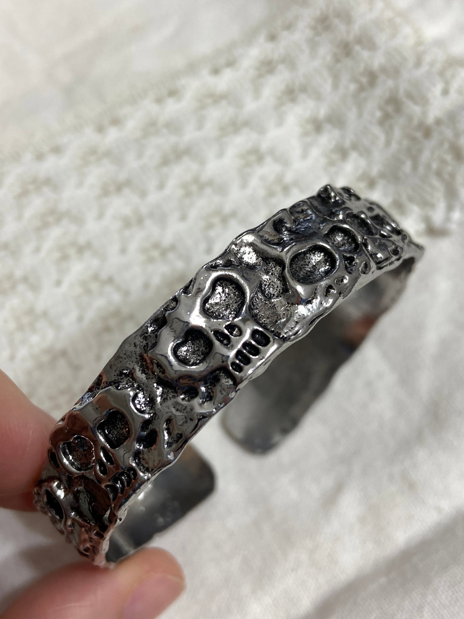 Wide Oni Skull Bangle - Titanium Steel: Title: Wide Oni Skull Bangle - Titanium Steel Description:Bold, intricate, and full of character, this wide Oni Skull Bangle is crafted from durable titanium steel and designed with a striking 1.4cm w