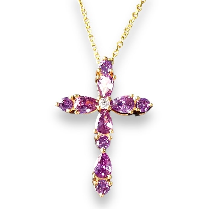 18K Gold Plated Amethyst Cross Pendant Necklace Moissanite Center: Title: 18K Gold Plated Amethyst Cross Pendant Necklace Moissanite Center Description:A finely crafted cross pendant necklace featuring ten faceted amethyst gemstones-five teardrop-cut and five round-c