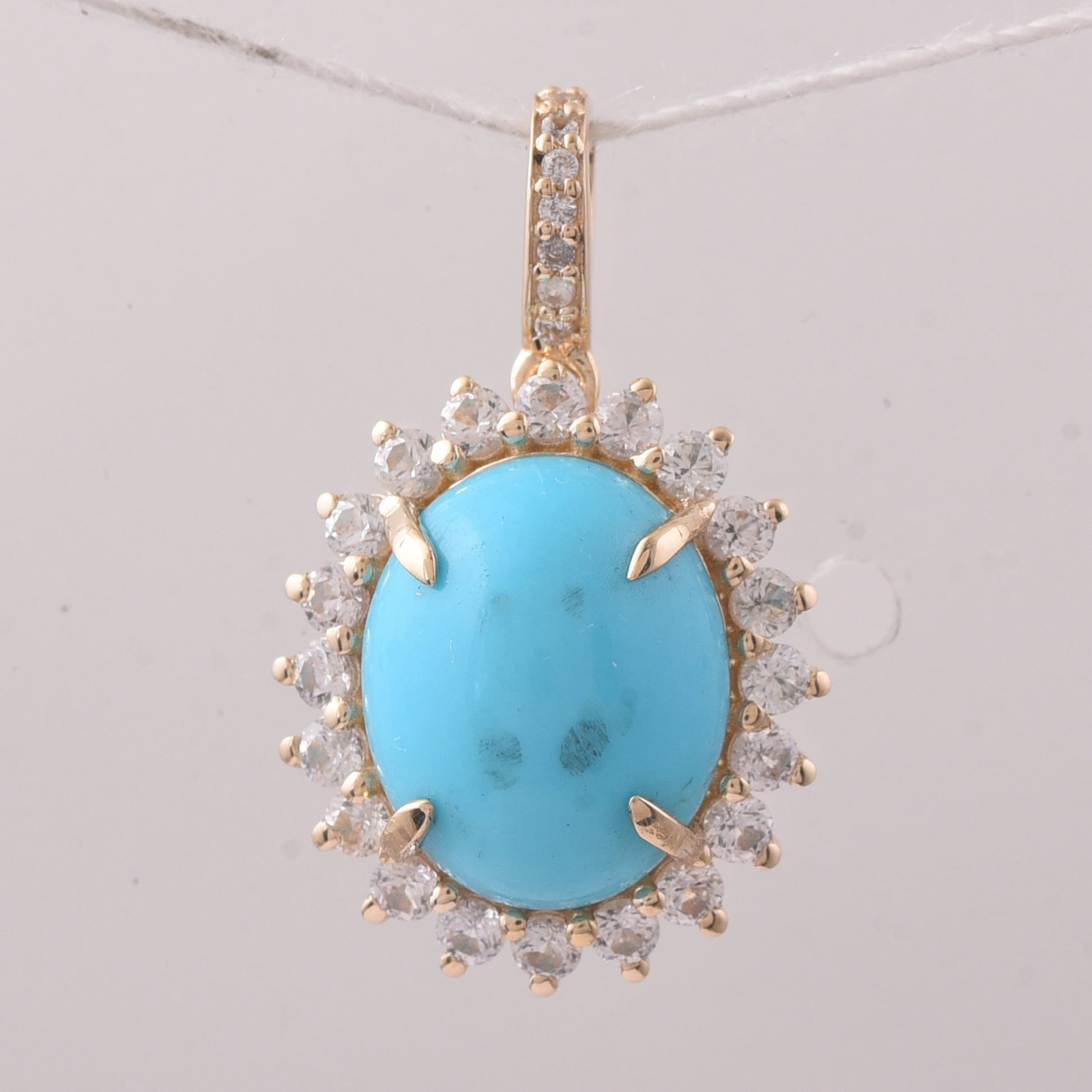 3.46 Ct Oval Turquoise 9K Gold Pendant: 3.46 Total Carat Turquoise 9K Gold Pendant Specifications: Total Weight 1.795 g Center Gemstone Turquoise Gemstone Carat Weight 2.86 Carats Gemstone Measurements 11X9X4.70 mm Additional Gemstones