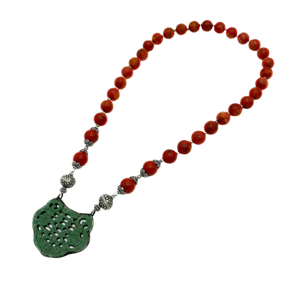 Sponge Coral Necklace with Jadeite Pendant: Title: Sponge Coral Necklace with Jadeite Pendant Description: This one of a kind necklace was created with 15 mm sponge coral and sterling components. It features a carved "Double Happiness" jadeite 