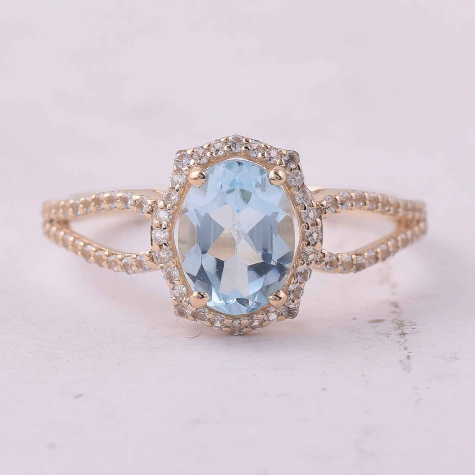 1.80 Ct Oval Blue Topaz 9K Gold Ring: 1.80 Total Carat Blue Topaz 9K Gold Ring Specifications: Total Weight 1.852 g Center Gemstone Blue Topaz Gemstone Carat Weight 1.5 Carats Gemstone Measurements 8X6 mm Additional Gemstones White