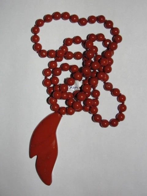 Brecciated Red Jasper Bead Necklace: Title:Brecciated Red Jasper Bead Necklace Description:Great endless necklace. Hand knotted in between each bead with cotton thread. Circa 1970's. Each bead measures 7 mm's. Pendant measures 2 3/4" by 