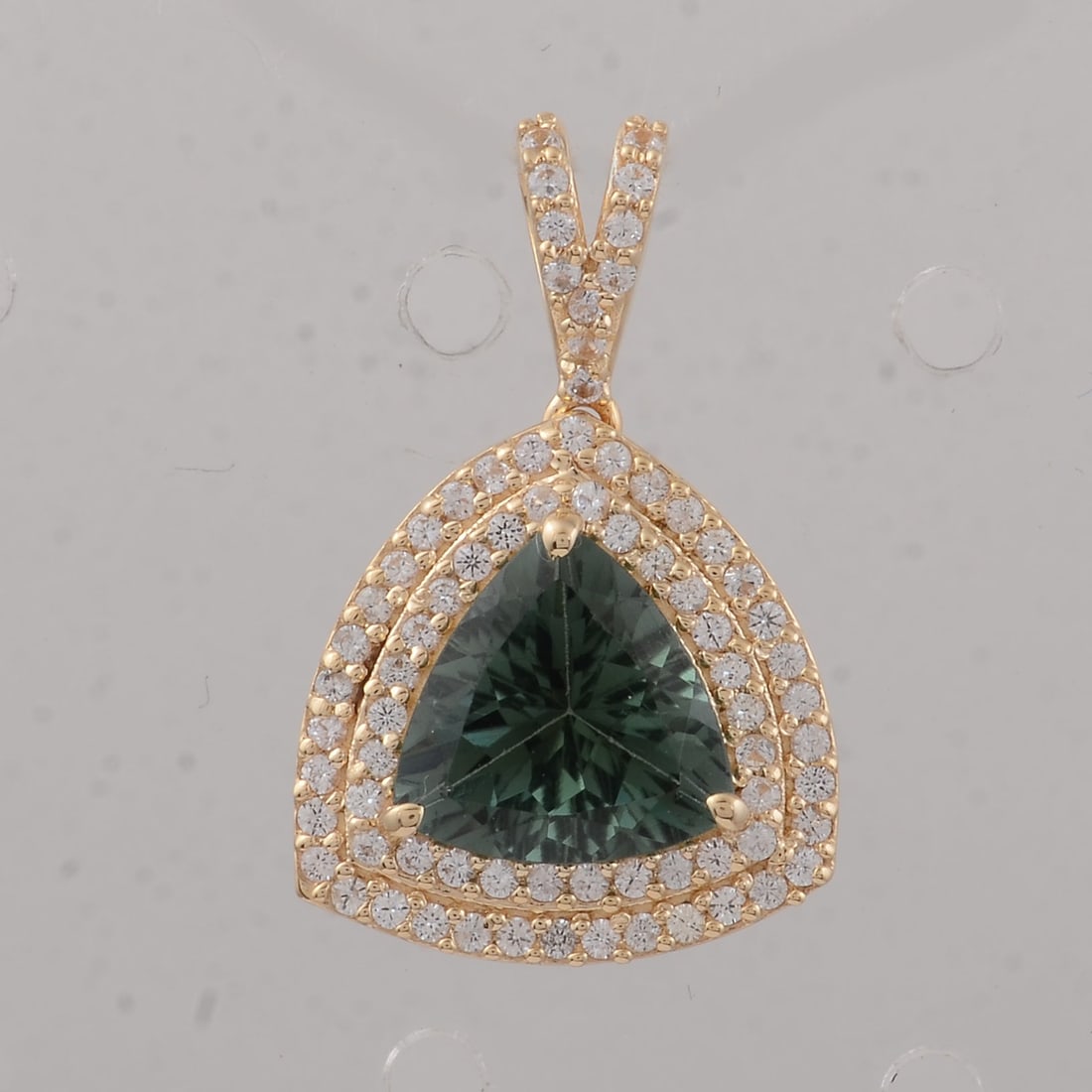 1.64 Ct Trillion Tourmaline 9K Gold Pendant: 1.64 Total Carat Tourmaline 9K Gold Pendant Specifications: Total Weight 1.51 g Center Gemstone Tourmaline Gemstone Carat Weight 1.31 Carats Gemstone Measurements 8X8X4.20 inch Additional Gemstones