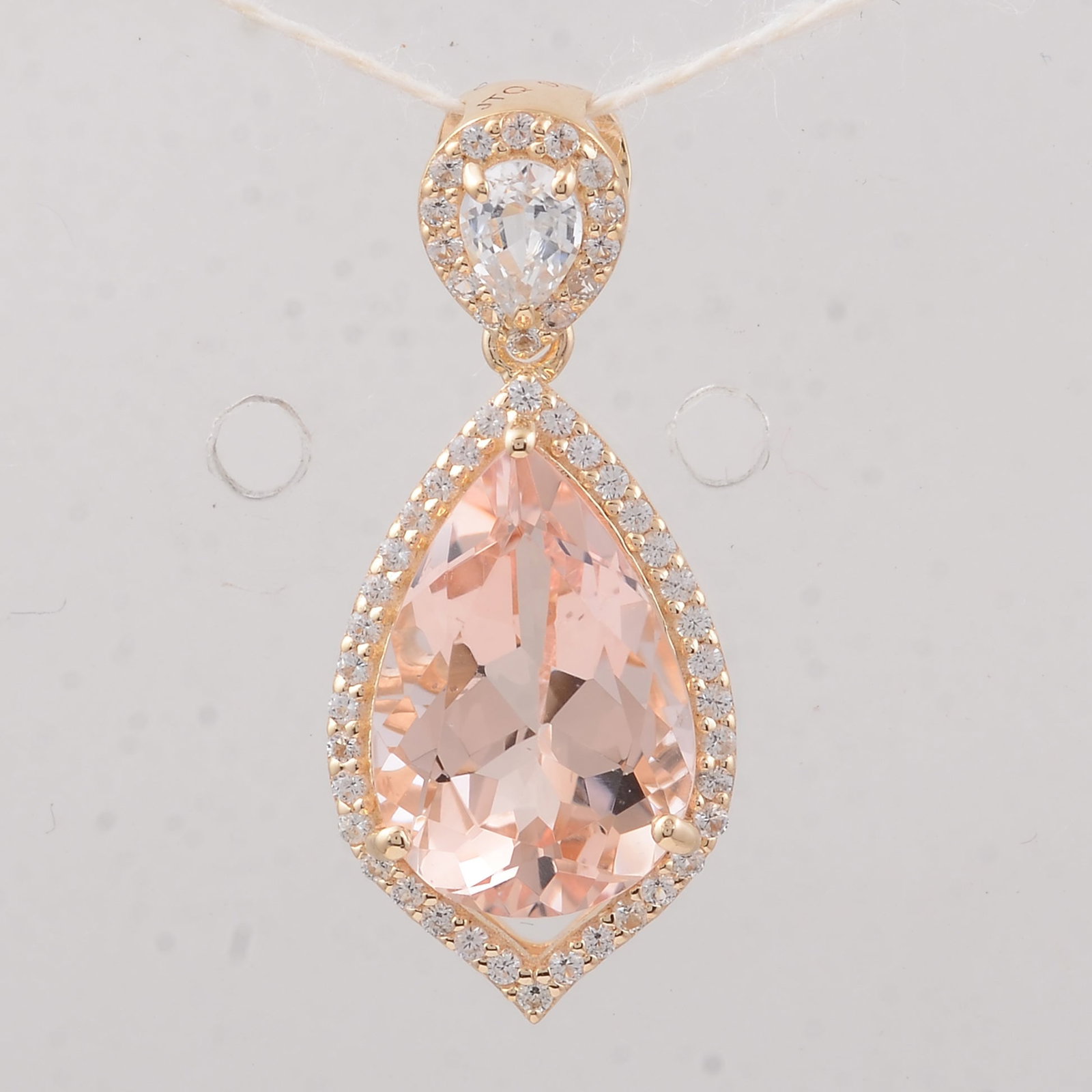 3.31 Ct Pear Morganite 9K Gold Pendant: 3.31 Total Carat Morganite 9K Gold Pendant Specifications: Total Weight 1.87 g Center Gemstone Morganite Gemstone Carat Weight 2.87 Carats Gemstone Measurements 12X8X5.70 mm Additional Gemstones White