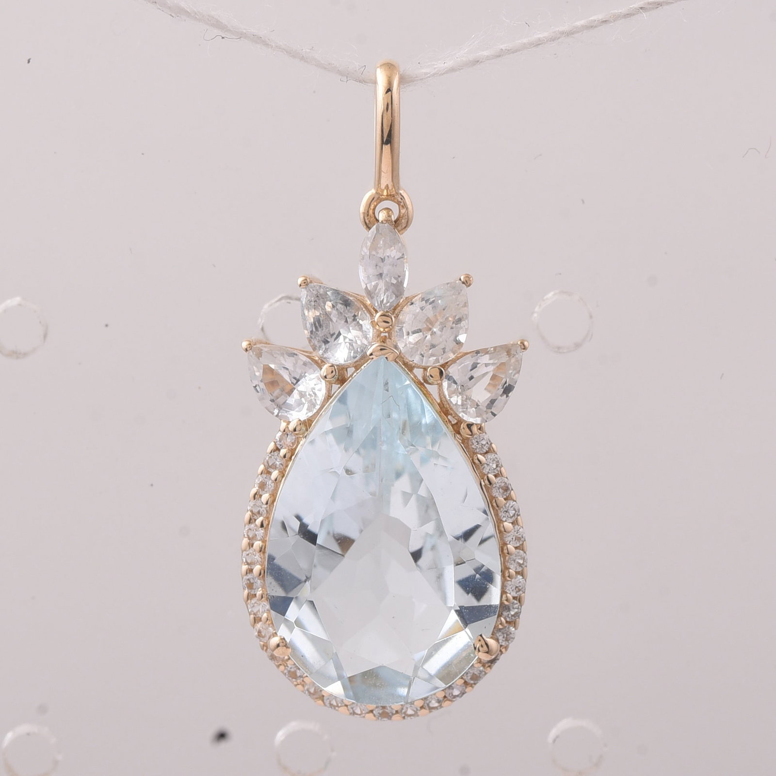 4.68 Ct Pear Aquamarine 9K Gold Pendant: 4.68 Total Carat Aquamarine 9K Gold Pendant Specifications: Total Weight 2.021 g Center Gemstone Aquamarine Gemstone Carat Weight 3.83 Carats Gemstone Measurements 15X10X5.20 mm Additional Gemstones W