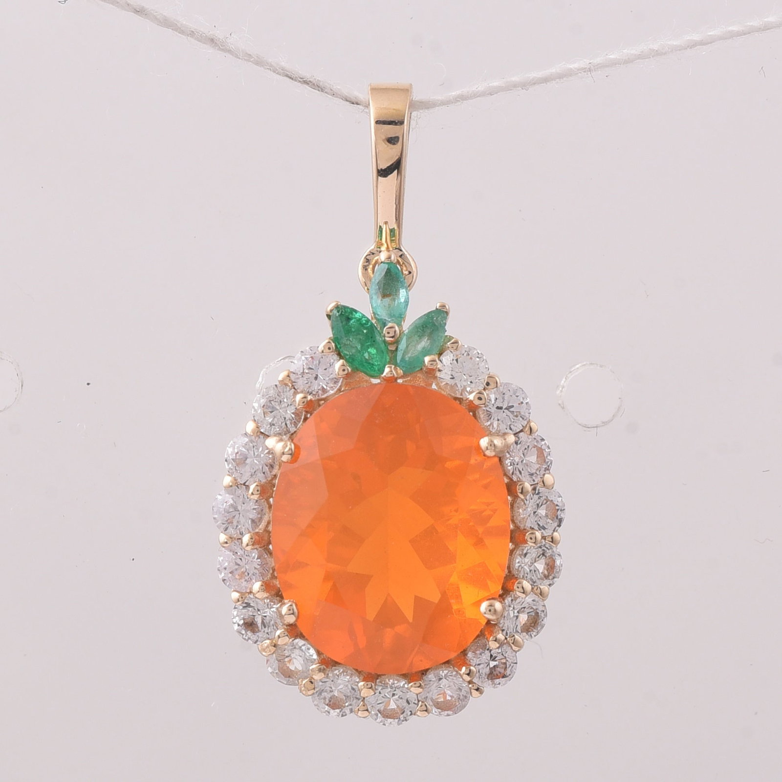 3.46 Ct Oval Fire Opal 9K Gold Pendant: 3.46 Total Carat Fire Opal 9K Gold Pendant Specifications: Total Weight 1.722 g Center Gemstone Fire Opal Gemstone Carat Weight 2.58 Carats Gemstone Measurements 11.10X9X6.50 mm Additional Gemstones E