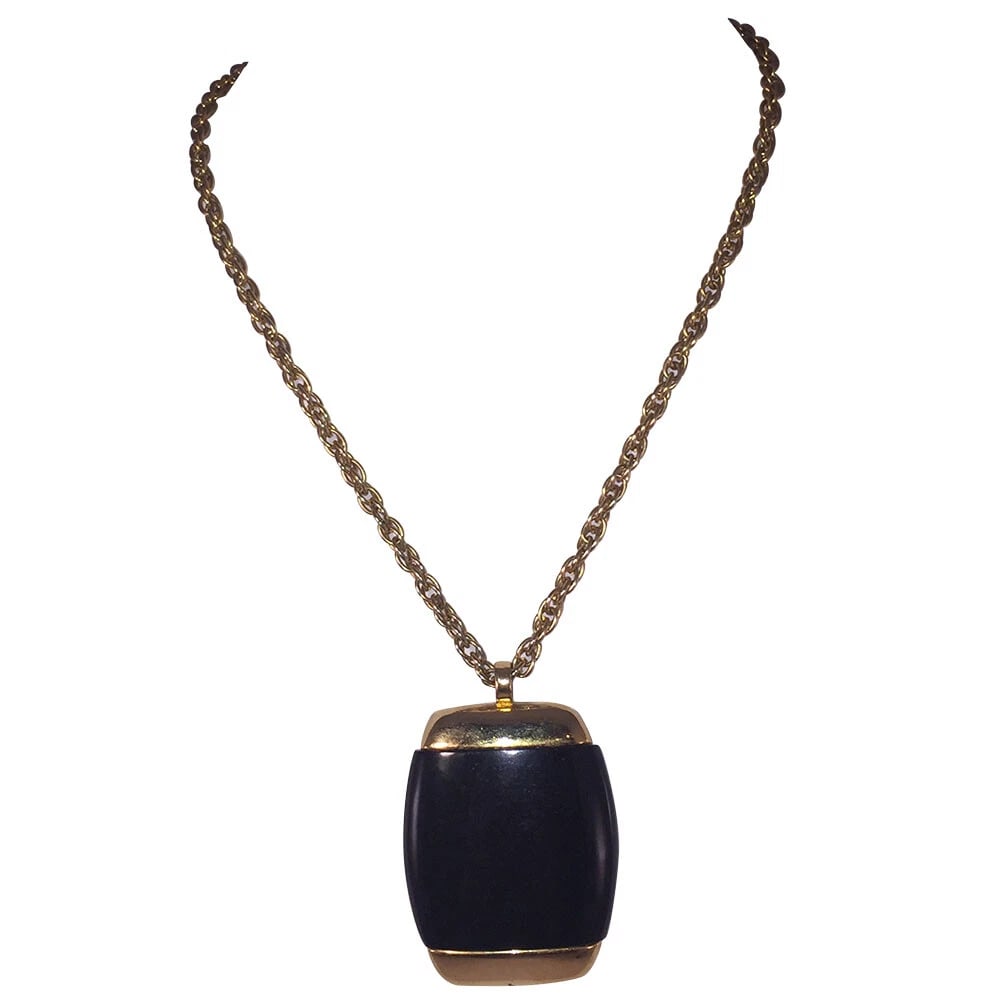 Lanvin Simulated Black Onyx Pendant Necklace: Title:Lanvin Simulated Black Onyx Pendant Necklace Description:Lanvin simulated plastic black onyx pendant necklace, 18 kt gold plated over costume metal. Circa 1970's. Pendant measures 2 1/2" long