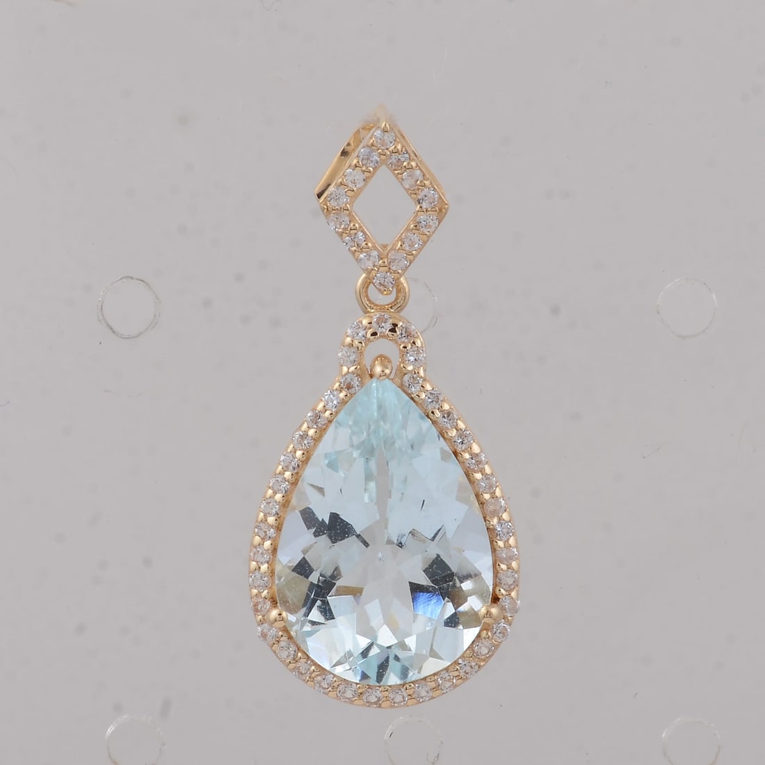 3.64 Ct Pear Aquamarine 9K Gold Pendant: 3.64 Total Carat Aquamarine 9K Gold Pendant Specifications: Total Weight 1.74 g Center Gemstone Aquamarine Gemstone Carat Weight 3.4 Carats Gemstone Measurements 13X9X5.80 inch Additional Gemstones Wh