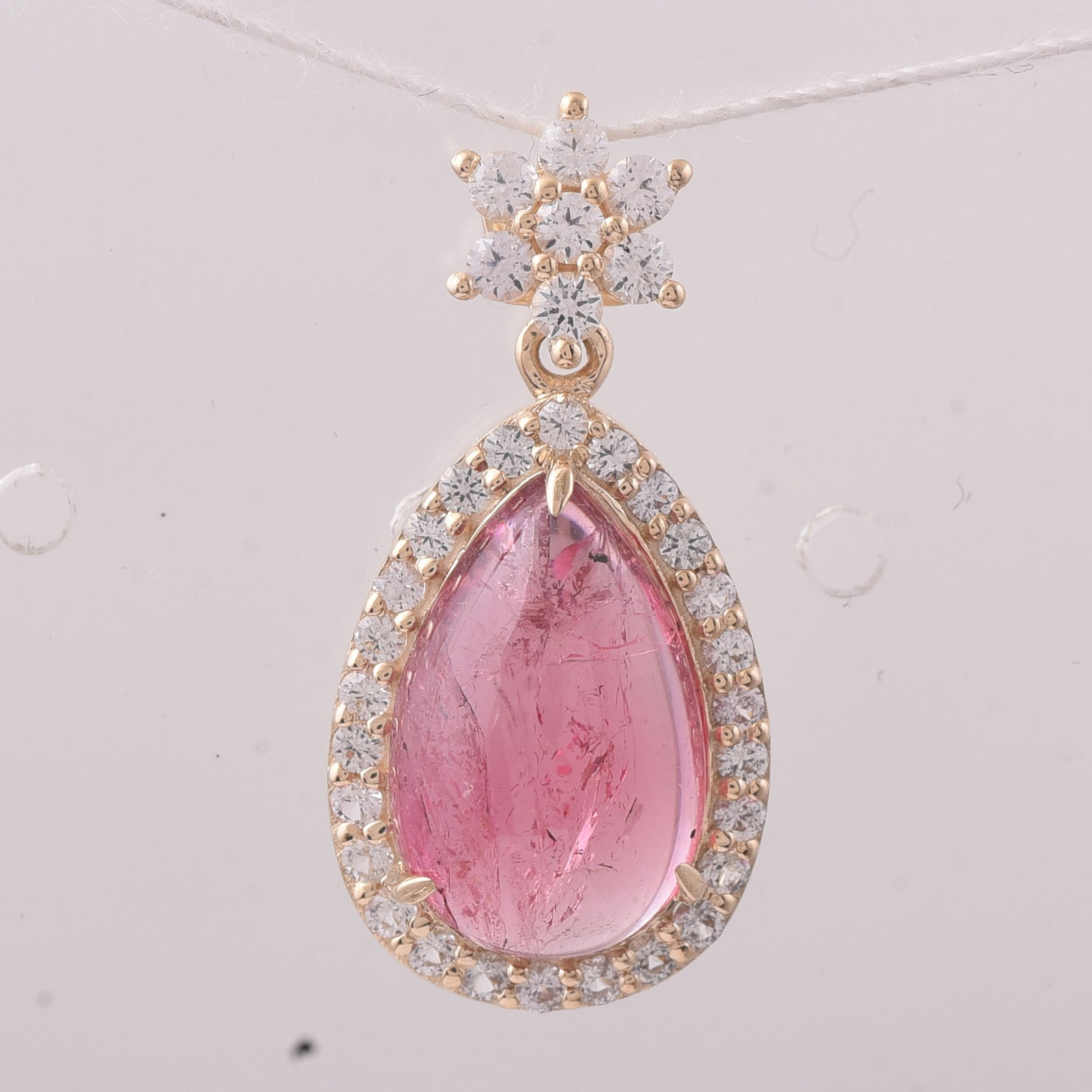 5.58 Ct Pear Tourmaline 9K Gold Pendant: 5.58 Total Carat Tourmaline 9K Gold Pendant Specifications: Total Weight 2.183 g Center Gemstone Tourmaline Gemstone Carat Weight 4.85 Carats Gemstone Measurements 14X9X5 mm Additional Gemstones White