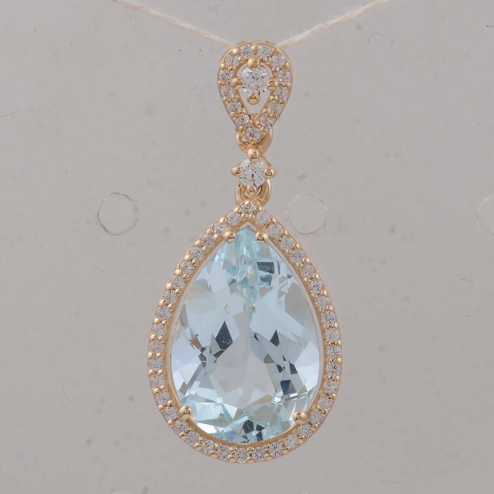 3.97 Ct Pear Aquamarine 9K Gold Pendant: 3.97 Total Carat Aquamarine 9K Gold Pendant Specifications: Total Weight 1.85 g Center Gemstone Aquamarine Gemstone Carat Weight 3.68 Carats Gemstone Measurements 13X9X6.10 mm Additional Gemstones Whi