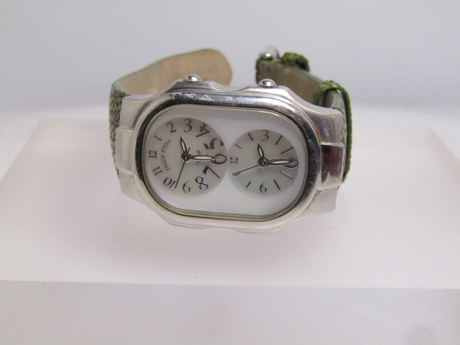 Philip Stein Ladies' Dual Time Teslar Watch, Green Stingray Band, 2002-2010: Title:Philip Stein Ladies' Dual Time Teslar Watch, Green Stingray Band, 2002-2010 Description:Philip Stein Ladies' Dual Time Teslar Watch, Green Stingray Band, 2002-2010. Silver tone with two dials
